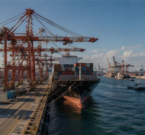 Cranes load a container ship at Port Halvern's deep-water terminal.